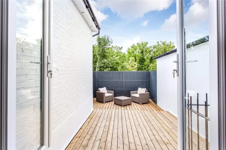 cozy terrace with chairs designed by basement company near me
