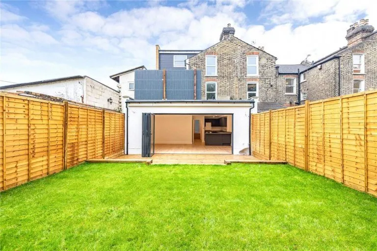 green backyard with new addition built by london basement company
